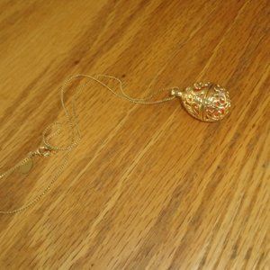 AFJ necklace gold tone egg shape locket